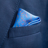 Chronos watch dial design silk pocket square in mid blue by Otway & Orford folded in top pocket