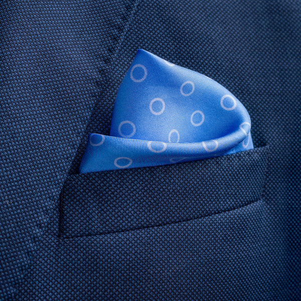 'Luna' polka dot silk pocket square in mid blue by Otway & Orford folded in top pocket